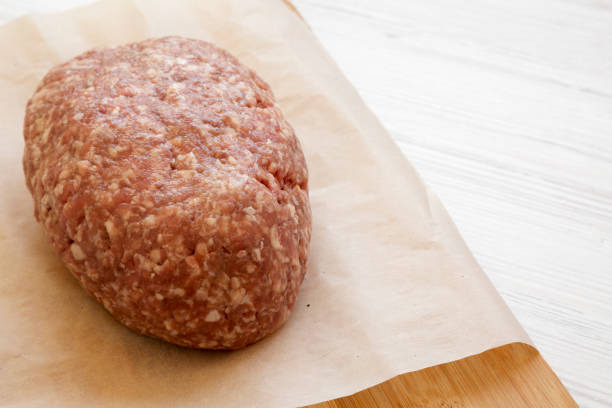 istock Fresh raw grass fed ground beef on a bamboo board, side view. Copy space. 1149622622