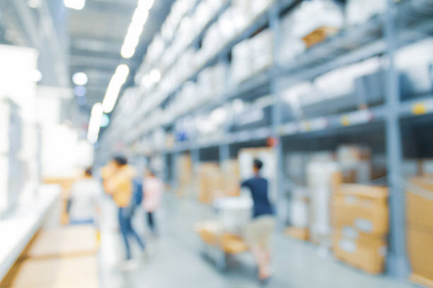 istock Blurred bix box store supercenter with customers shopping for home goods. 1149622984