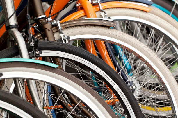 bicycle wheels, close-up bicycle wheels standing in a row in a warehouse or in a store bicycle stock pictures, royalty-free photos & images