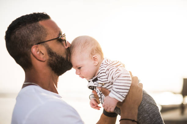istock Father kissing his baby son. 1149625294