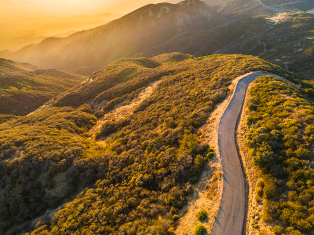 istock Winding mountain road at sunset in California 1149625646
