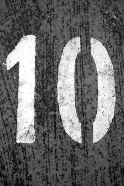 istock Number 10 in stencil on metal wall in black and white 1149626855