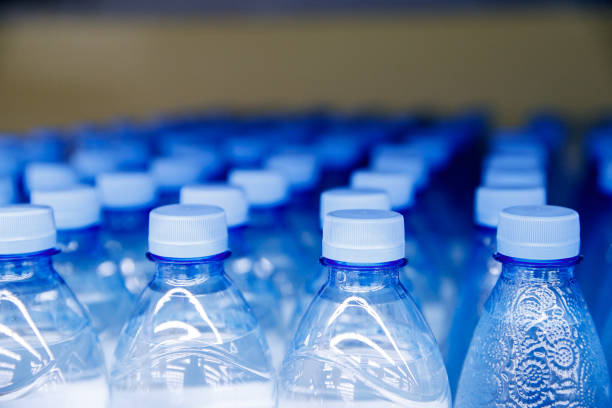 istock Lid plastic water bottle in the market. multi-colored plastic bottle caps 1149629763