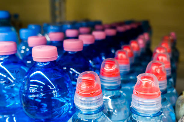 istock Lid plastic water bottle in the market. multi-colored plastic bottle caps 1149629773