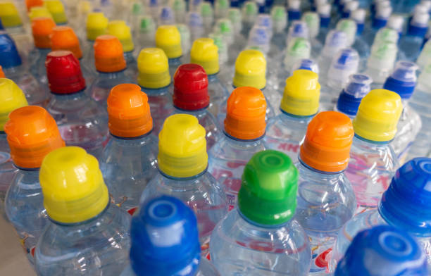 istock Lid plastic water bottle in the market. multi-colored plastic bottle caps 1149629799