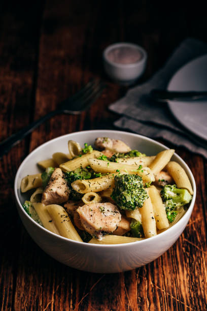 Pasta with chicken and broccoli Creamy whole wheat pasta with chicken and broccoli chicken rigatoni stock pictures, royalty-free photos & images