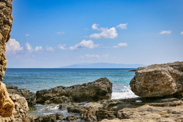 istock Rocky beach with crystal clear water 1149637576