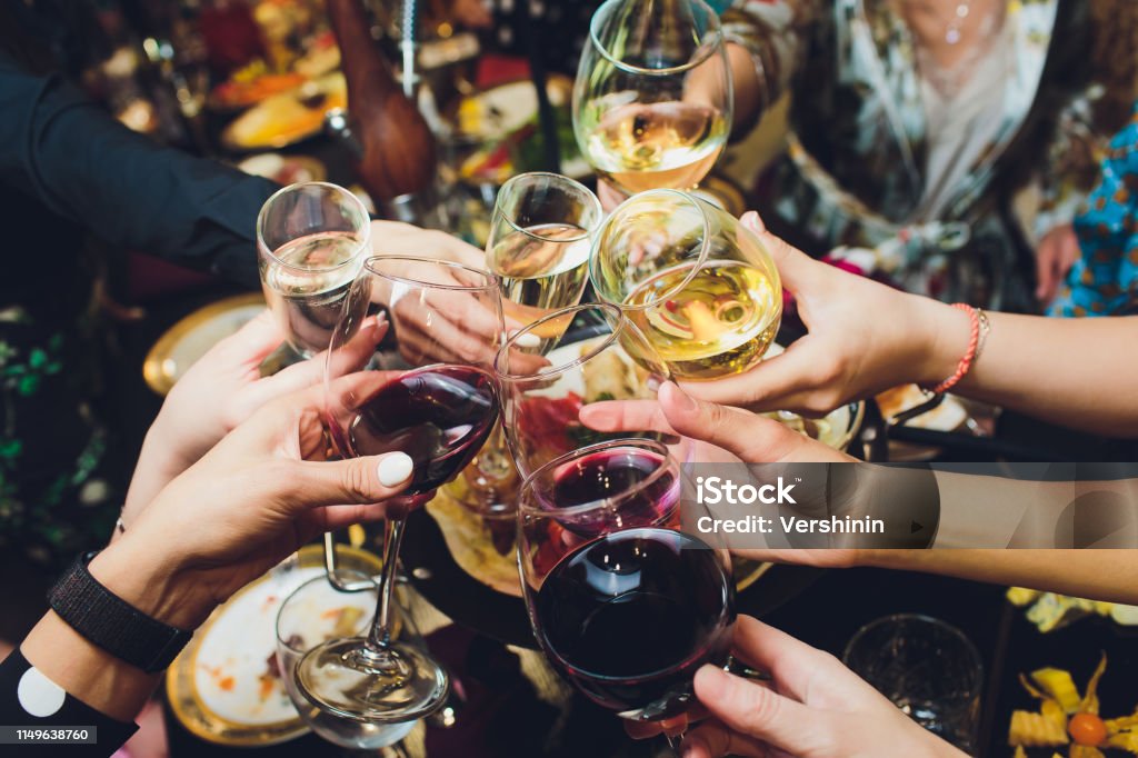 Champagne glasses in hands of people at party. Champagne glasses in hands of people at party Celebratory Toast Stock Photo