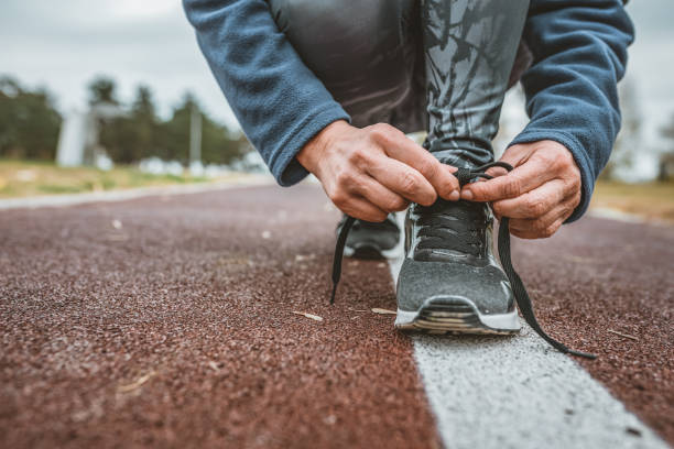 istock Woman Tying Shoelaces 1149639594