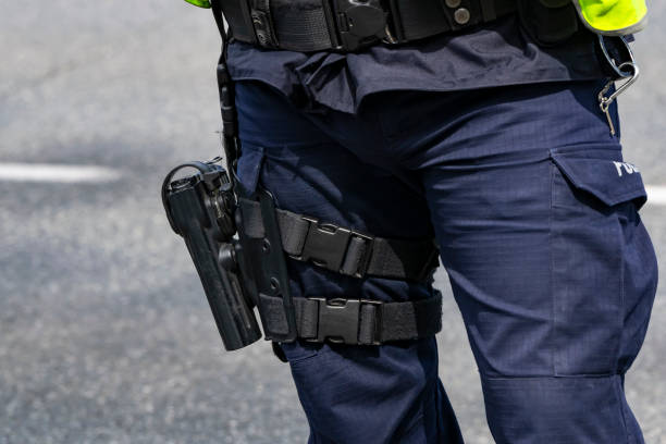 istock Pistol on the policeman's leg 1149659744