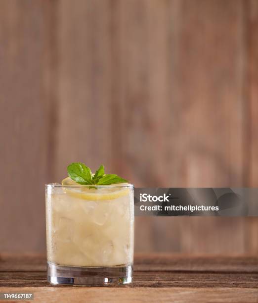 Lemon Rye Smash Cocktail Stock Photo - Download Image Now - Cocktail, Tequila - Drink, Lemon - Fruit