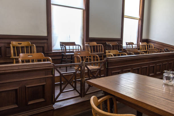 istock Empty Juror Box And Defendant Table In American Courtroom 1149687360