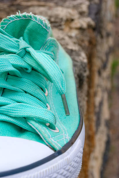istock green sport shoe in the foreground 1149687437