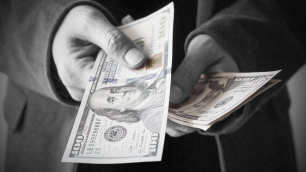 istock Man giving money from his wallet 1149687537