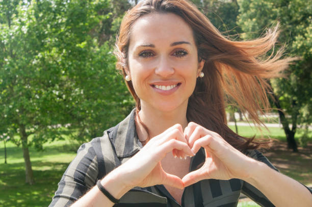 istock Cheerful beautiful girl posing and expressing love 1149689287