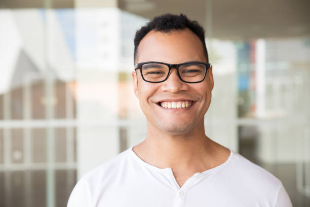 istock Smiling man standing at building, looking straight at camera 1149692569