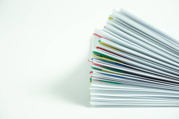 istock Pile of documents on the desk. white background. 1149698231