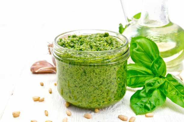 istock Pesto in glass jar on board 1149701540
