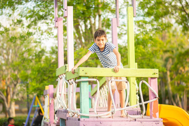 istock Little boy playing in the playground outdoor 1149702368
