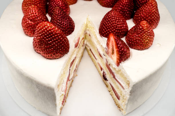 istock white red layered strawberry short cake with missing peace 1149702587
