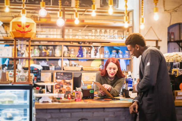 istock Waitress and customer in a cafe 1149703800