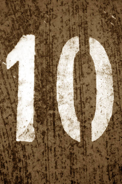 istock Number 10 in stencil on metal wall in brown tone 1149710863