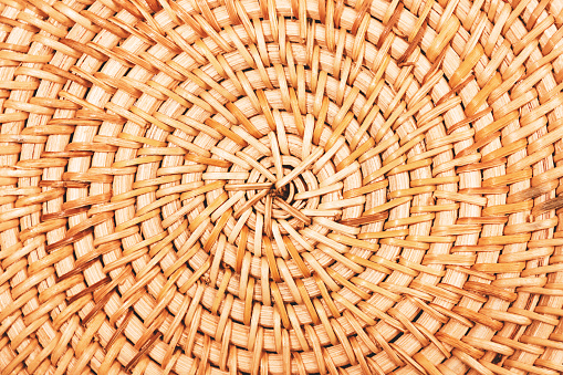 Bamboo bag or round placemat texture closeup. Natural background.