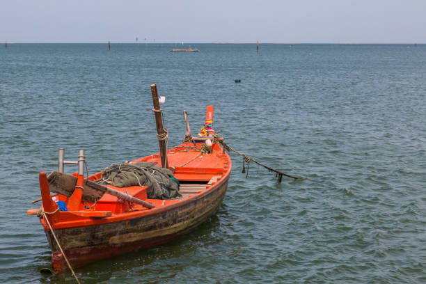 istock Orange wood fishing boat 1149713558