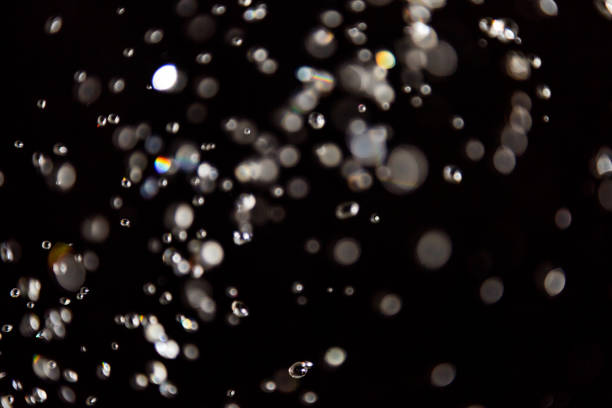 istock bokeh of water drops levitating in the air reflection 1149714730