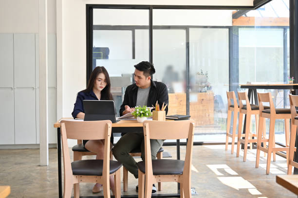 istock Co working space office, Two young business talking and meeting on desk. 1149719039