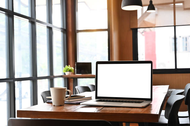 istock Laptop computer on working table with a wood desk. 1149719244