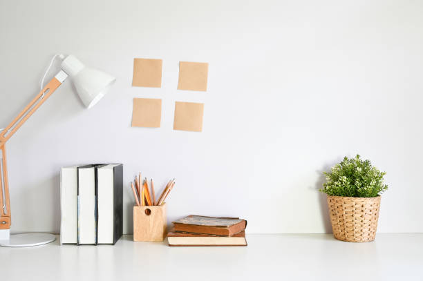 istock Workspace with books, pencil, sticky note and plant decoration. 1149719301