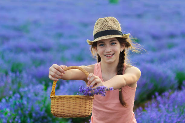istock Beautiful girl in lavender field 1149719372