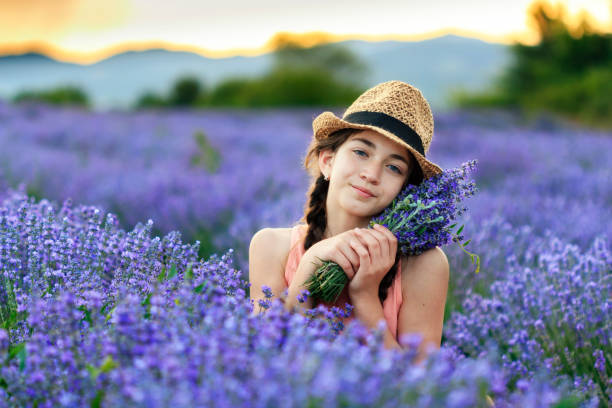 istock Beautiful girl in lavender field 1149719383