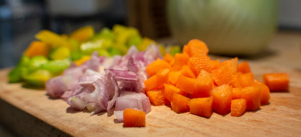 istock Sliced green pepper, shallots and carrots 1149721795