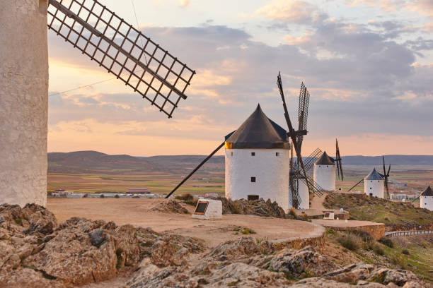 istock Traditional antique windmills at sunset in Spain. Consuegra, Toledo 1149722340