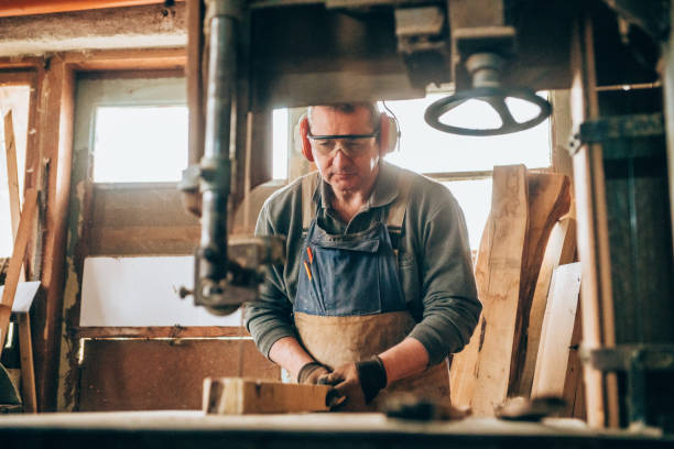 istock Carpenter cutting wooden plank 1149725984