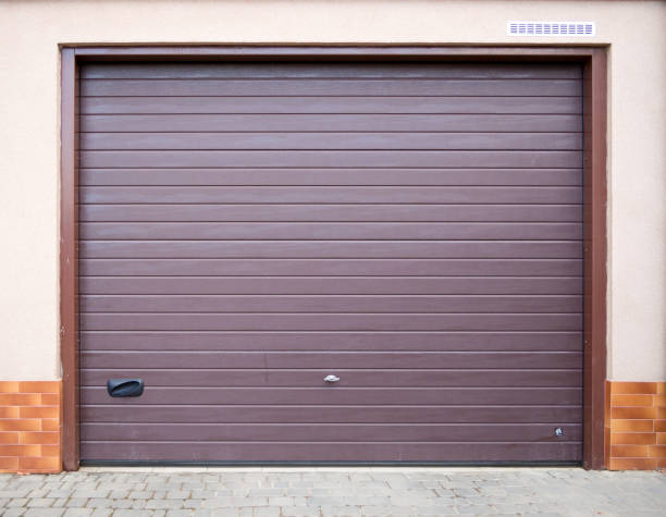istock The entrance to the garage is equipped with a roller shutter gate. 1149726129