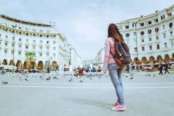 Young caucasian female tourist at Aaristotle square, Thessaloniki.