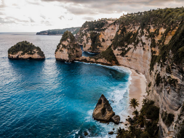 istock Beautiful beach below rocks at sunset. Diamond beach, Nusa Penida 1149726942