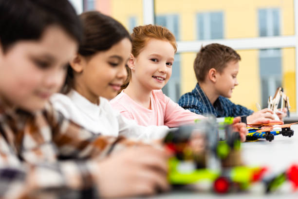 istock Pupils sitting at desk with toys during lesson in classroom 1149728723