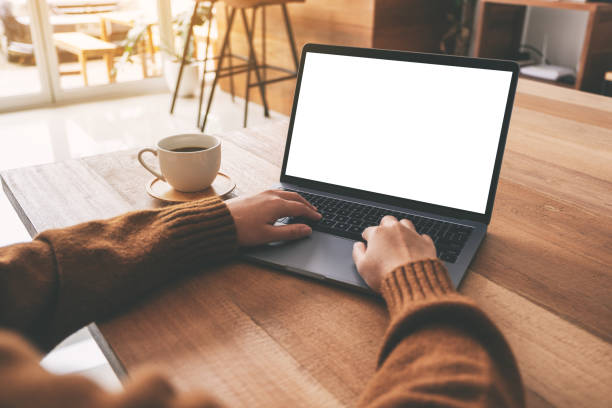 istock a woman's hand using and typing on laptop with blank white desktop screen 1149731399