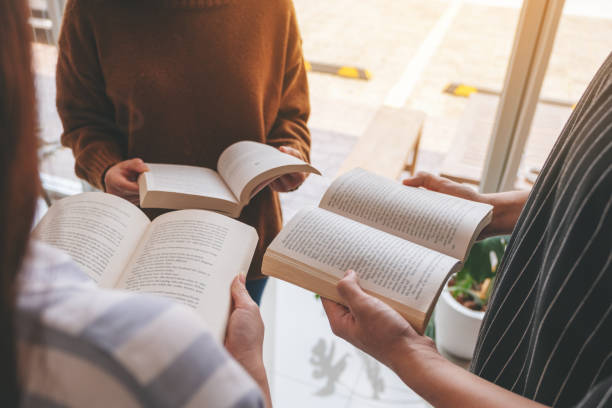 istock people standing in circle and enjoyed reading books together 1149731668