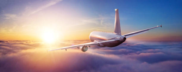 istock Passengers commercial airplane flying above clouds 1149732689