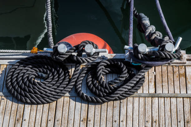 istock Two black ropes on the sea pier 1149732911