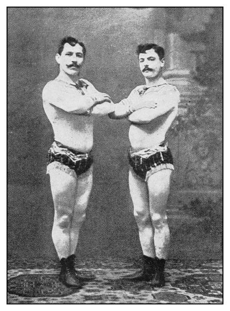 Antique photo: Circus performers acrobats Antique photo: Circus performers acrobats circus performer stock illustrations