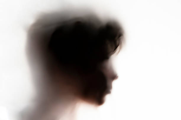 persons head shadow on a white glass or surface,terrible ghost in a night time