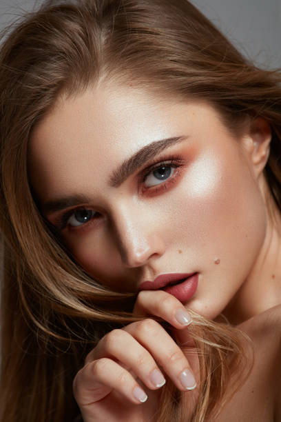 close-up portrait of young beautiful woman isolated on photo studio background - women beauty innocence make up imagens e fotografias de stock