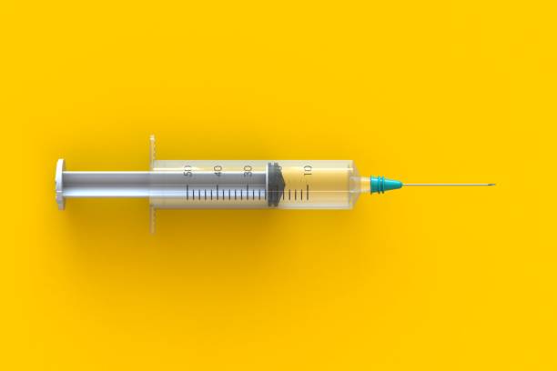 istock Empty syringe closeup isolated on yellow background, High resolution, Top view with copy space, Medical concept, 3d rendering 1149744625
