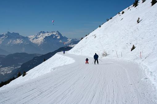 Ski, winter, snow - family enjoying winter vacation in Verbier, Switzerland